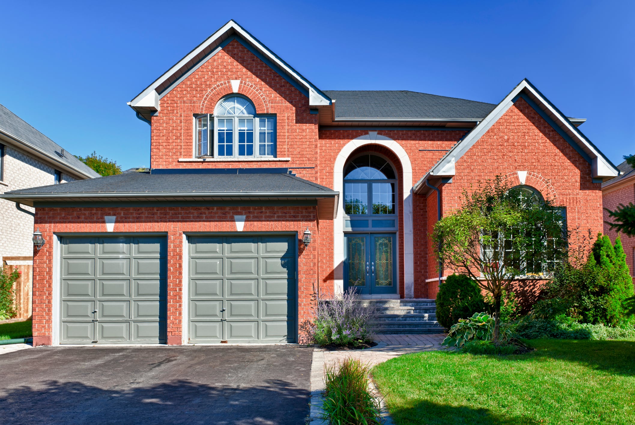 Brick suburban house exterior – example of a home that can be sold as-is for cash